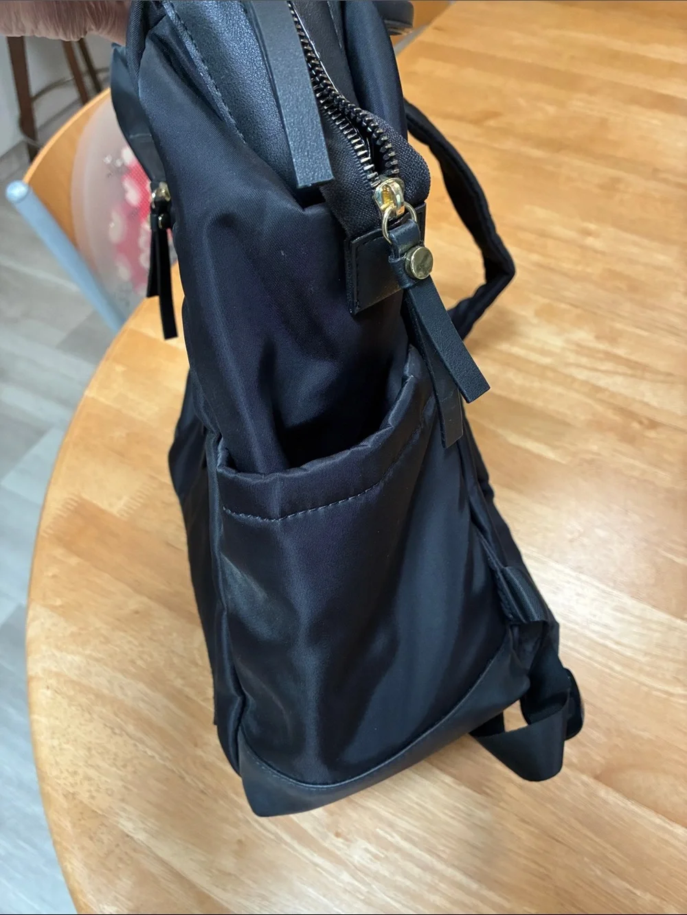 Tutilo Black Men's Backpack with Gold Zipper Accents